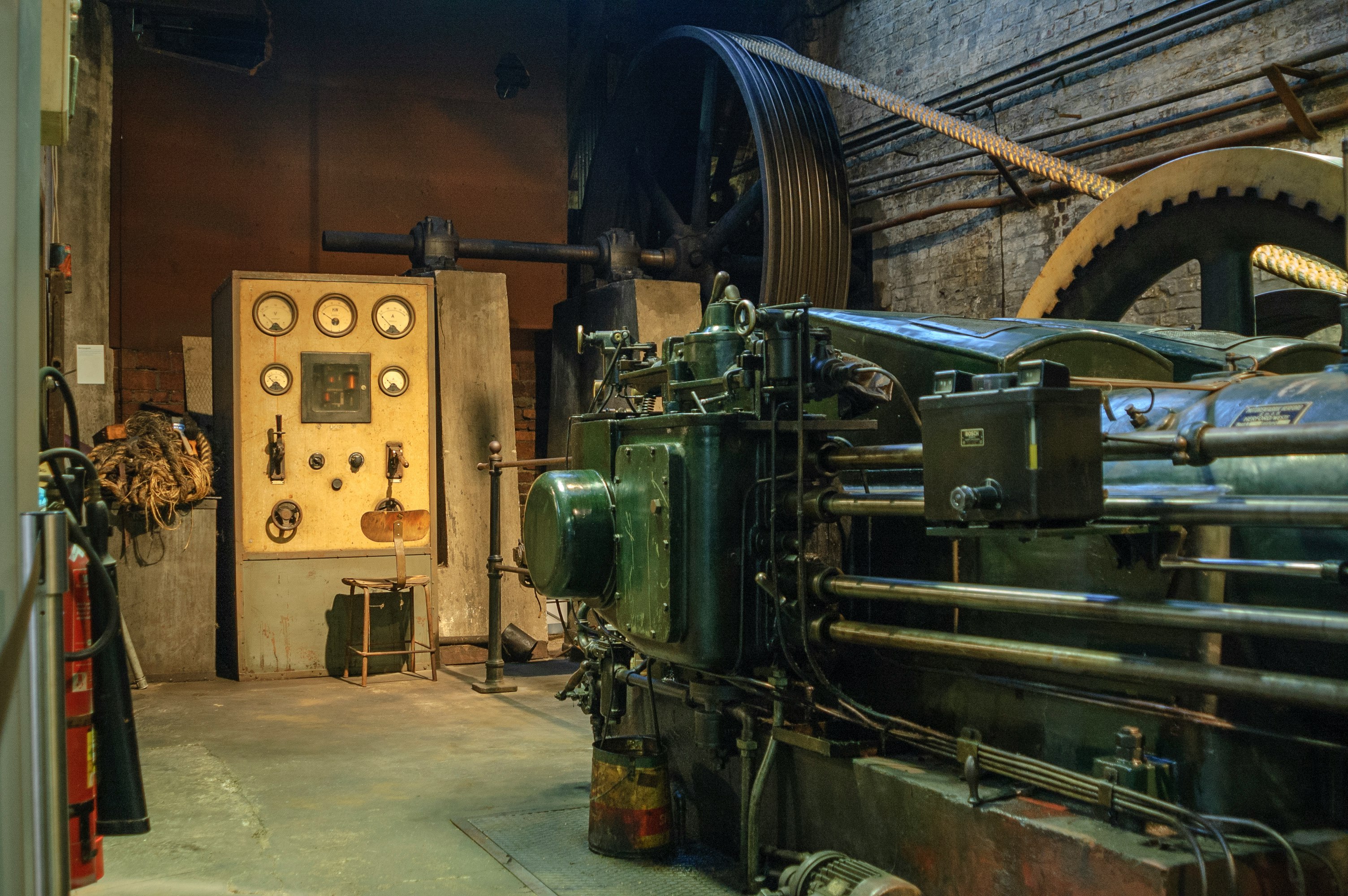 black electronic machine beside wall